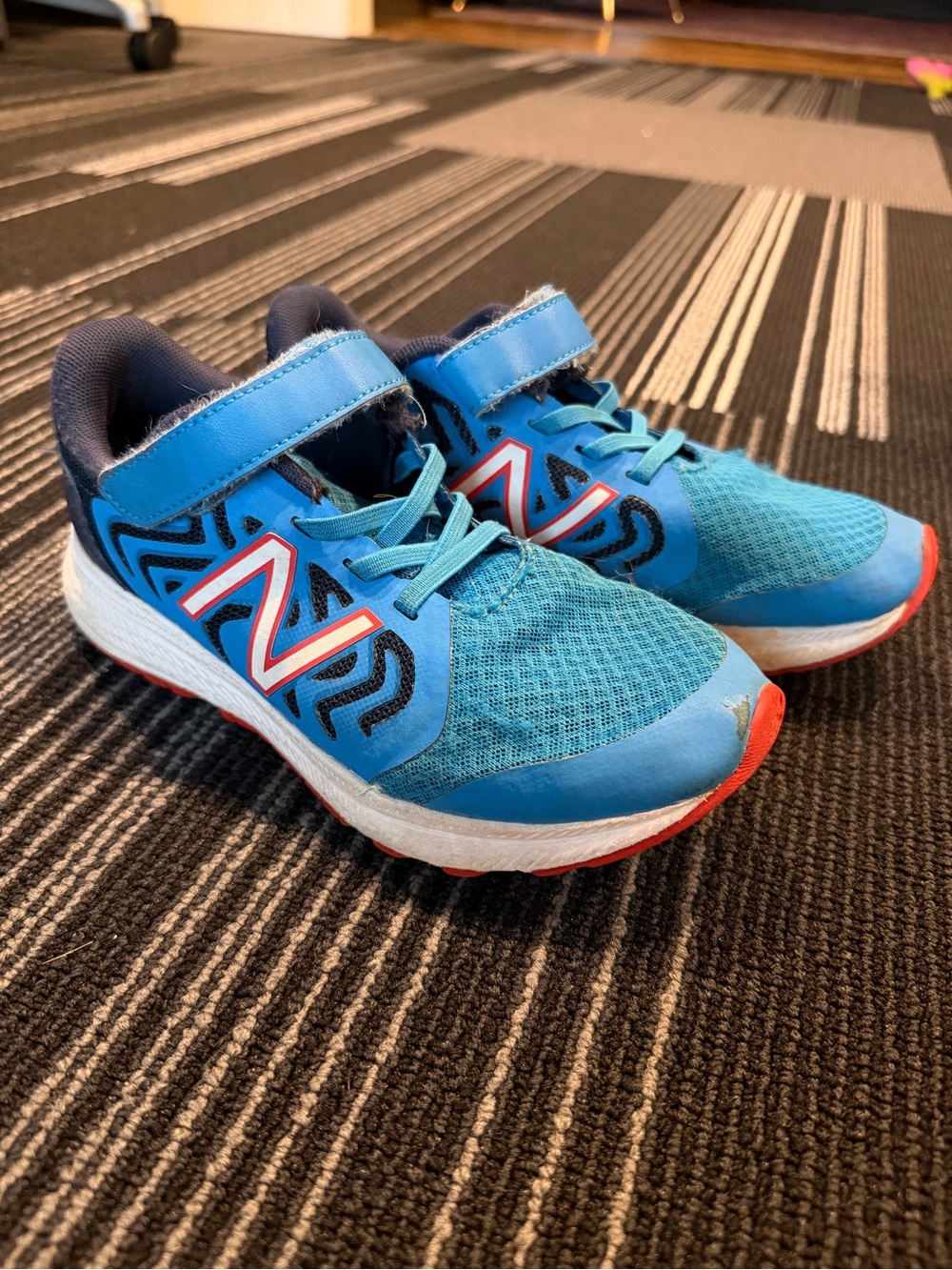 New Balance Kids Blue and Red Accent Athletic Sneakers